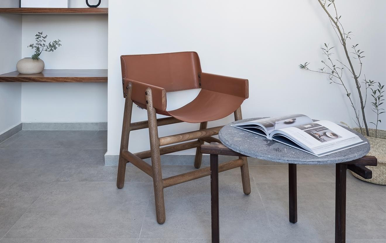 Scandinavian room interior design with armchair and coffee table