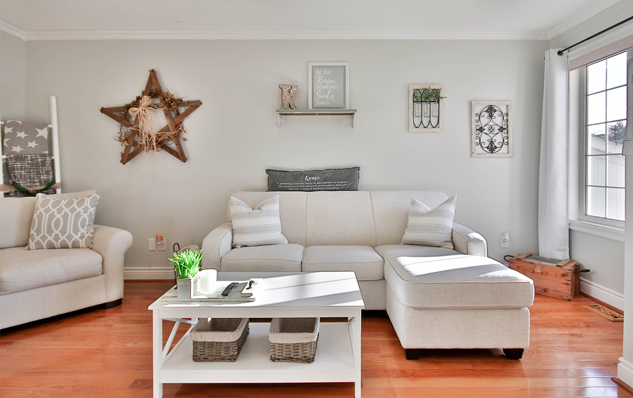 White living room with wood flooring