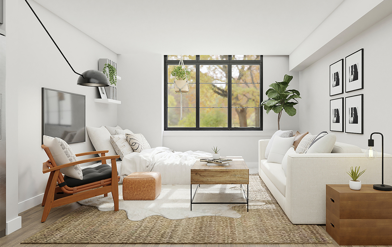 Studio interior with whtie sofa and bed