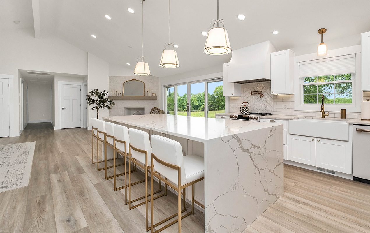 Large waterfall kitchen island by DeCasa Collections