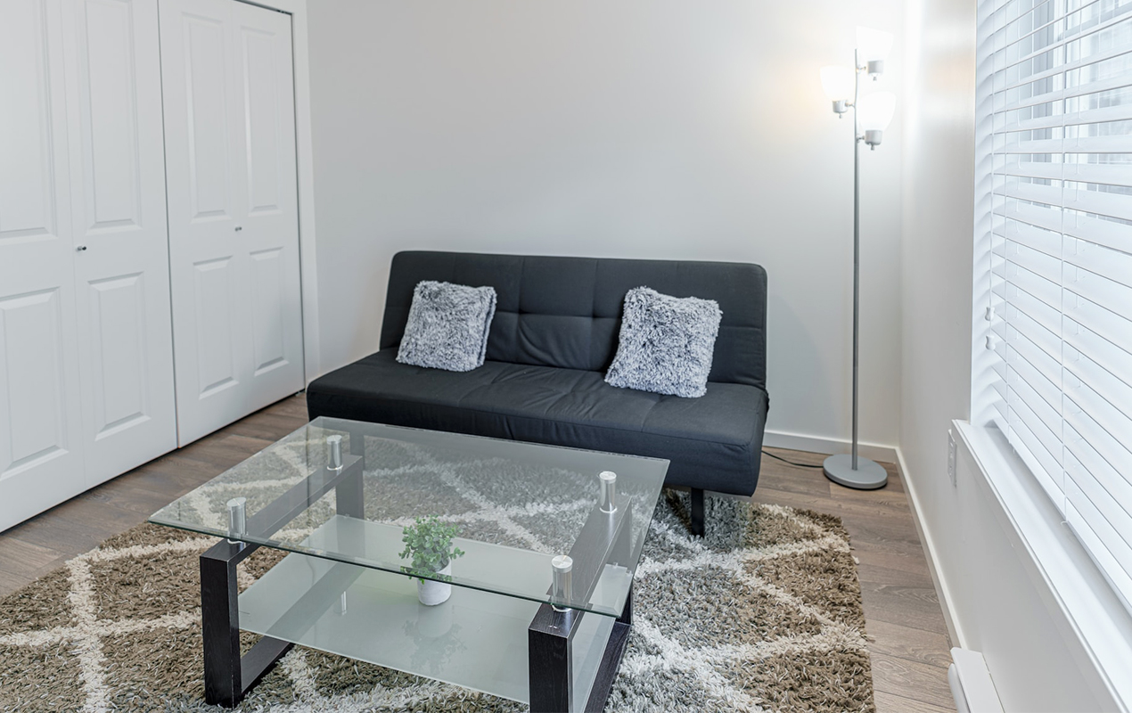 Living room with sofa and glass coffee table