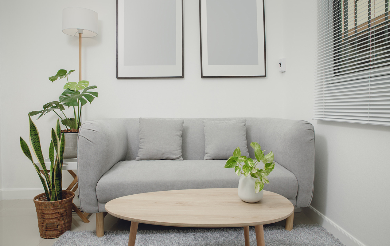 White interior with gray sofa and coffee table