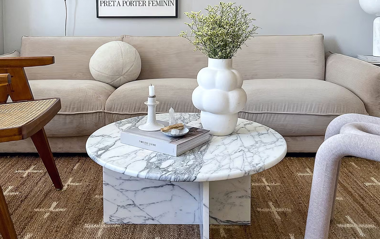 Living room setting with neutral sofa and white table