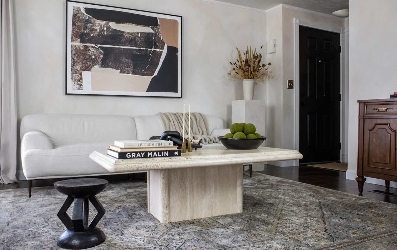 Modern living room with large table and wall art