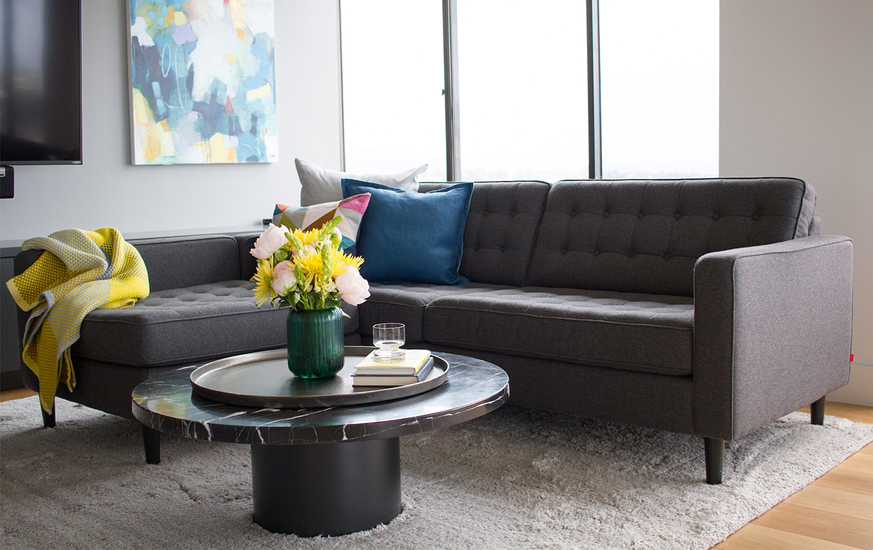 Coffee table with marble top and vase of flowers