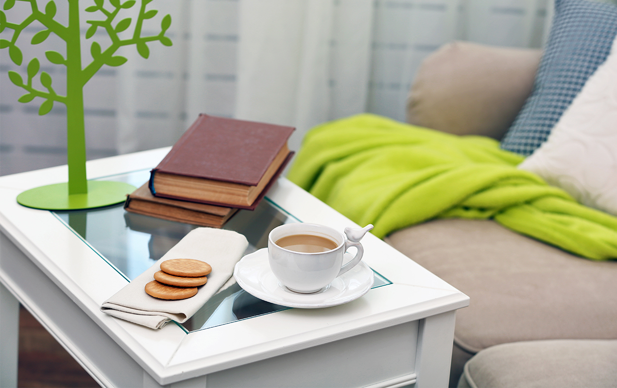 Cup coffee with books table living room