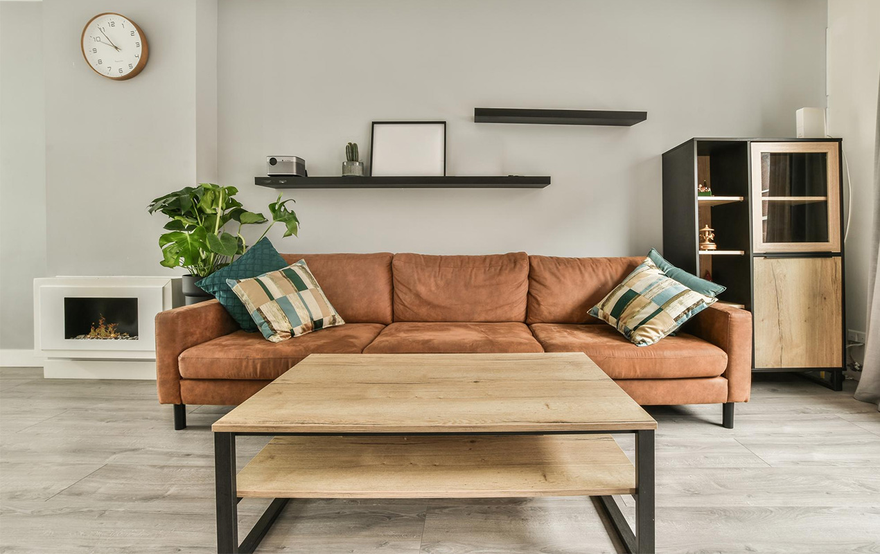 Living area with tan couch and rectangular coffee table