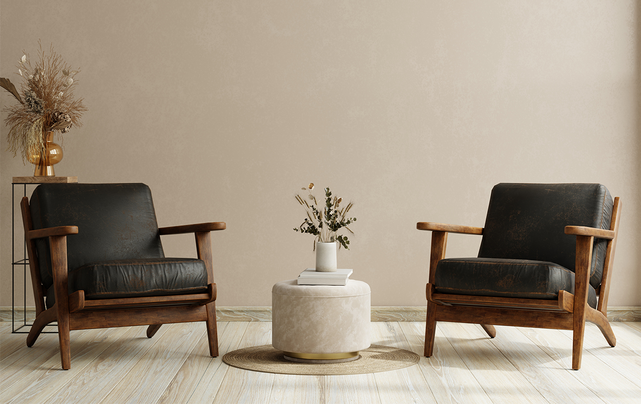 Living room with two leather armchair and suede coffee table