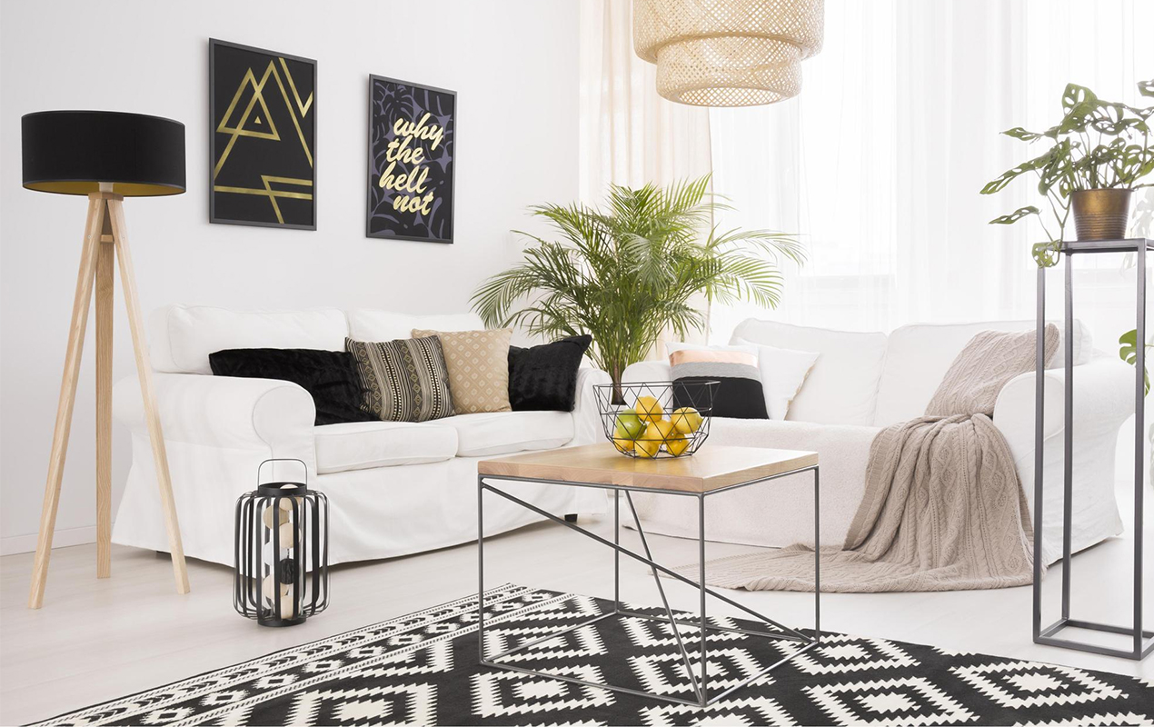 living room with white sofa and black-gold rug