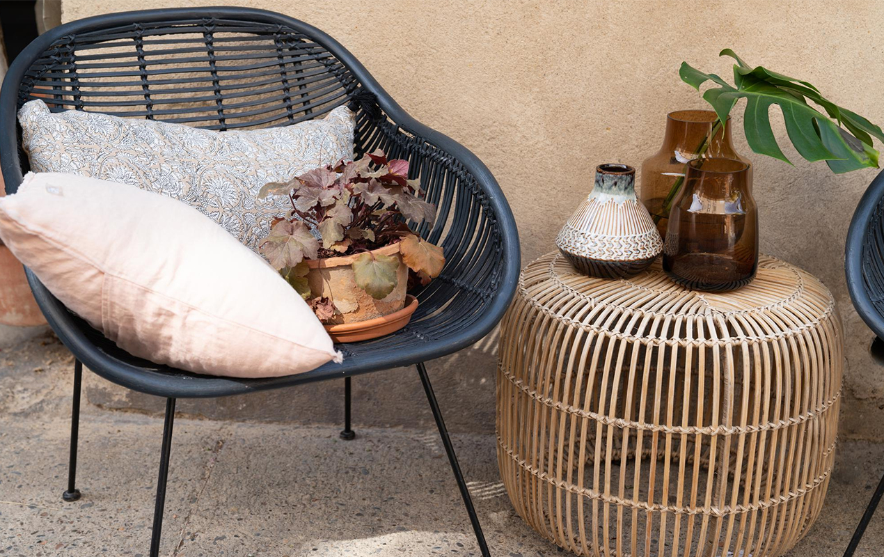 Out patio setting with chair and wicker coffee table