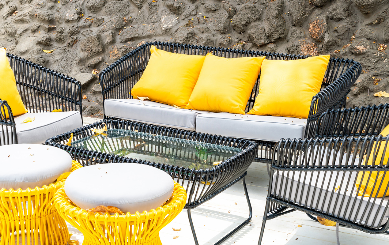 Colorful outdoor setting with seating and coffee table