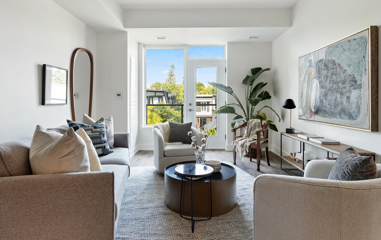 Neutral living room with drum coffee table and black side table