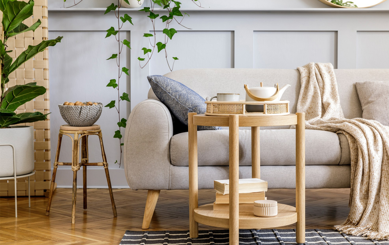 Scandinavian interior with gray sofa wooden coffee table
