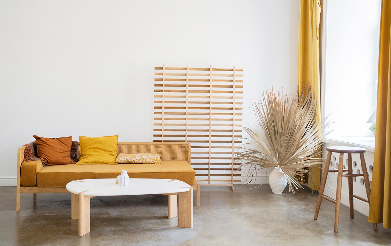 Minimalist interior with yellow accent and white wood coffee table