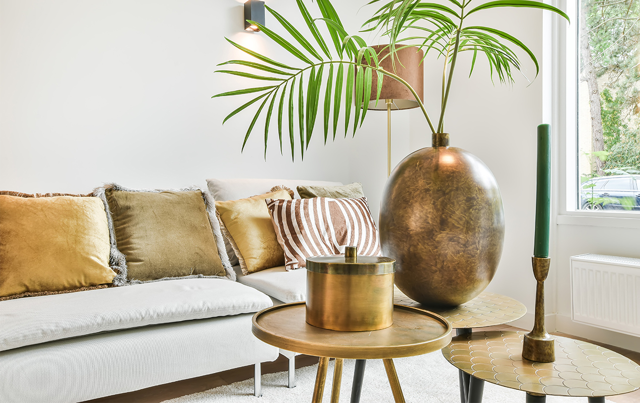 Living room with metal accents and gold accessories