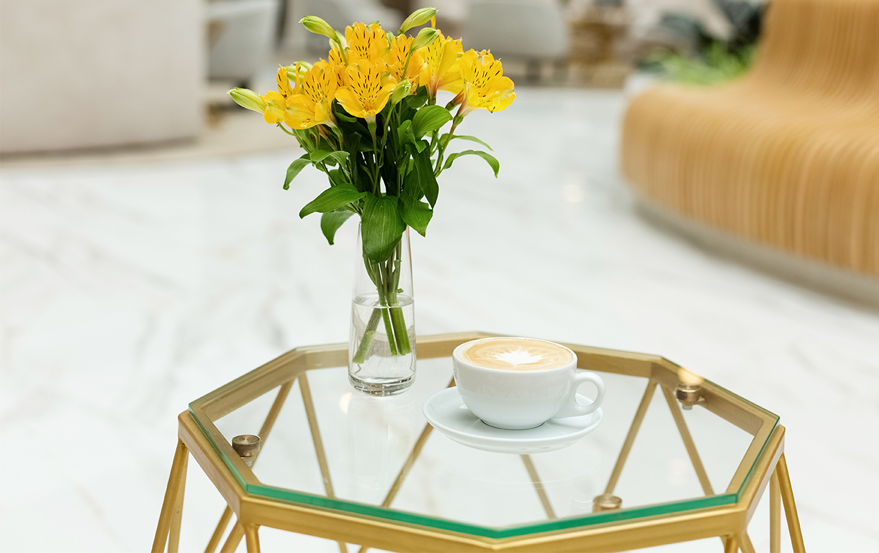 Coffee Table Decor with Metallic Accents, Yellow Blooms, and Cozy Moments