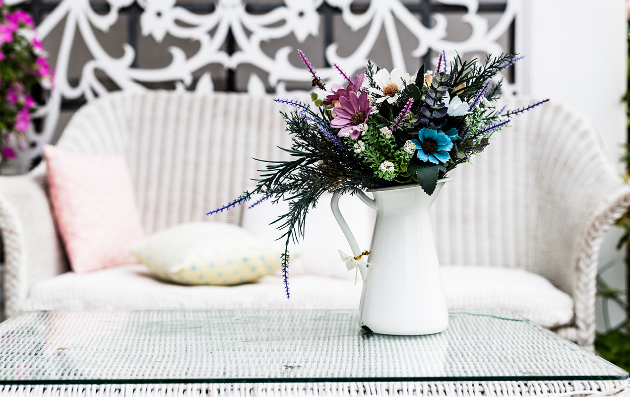 White interir with White vase jug and flower accents