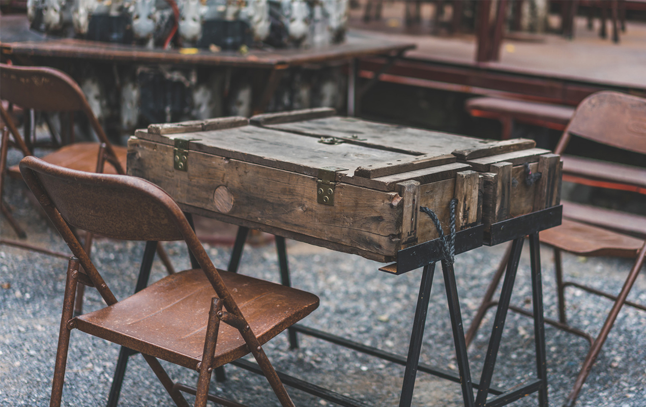 Enhance Your Space with a Retrograde Trunk Coffee Table and Brown Chairs