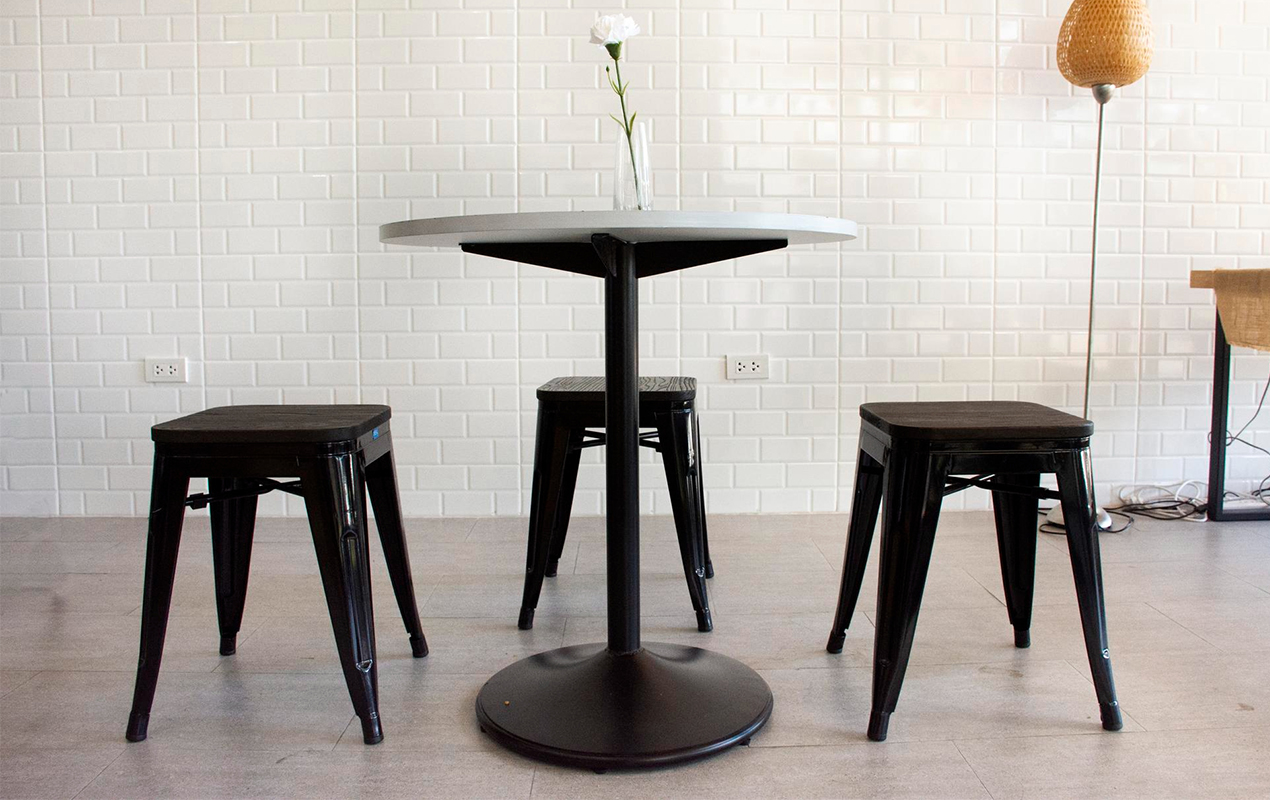 Monochrome Marvel: The Round White-Top Coffee Table with Square Metallic Stools