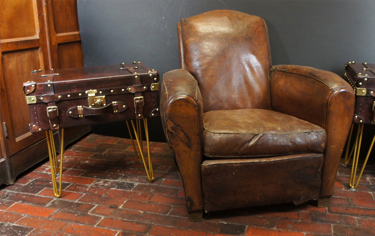 The Leather Nightstand Trunk Coffee Table and Brown Leather Armchair Duo