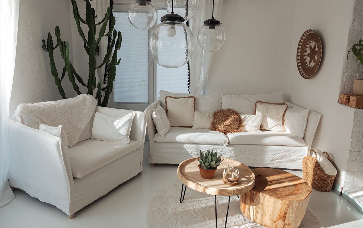 The Petite Round Coffee Table and Cozy White Sofas