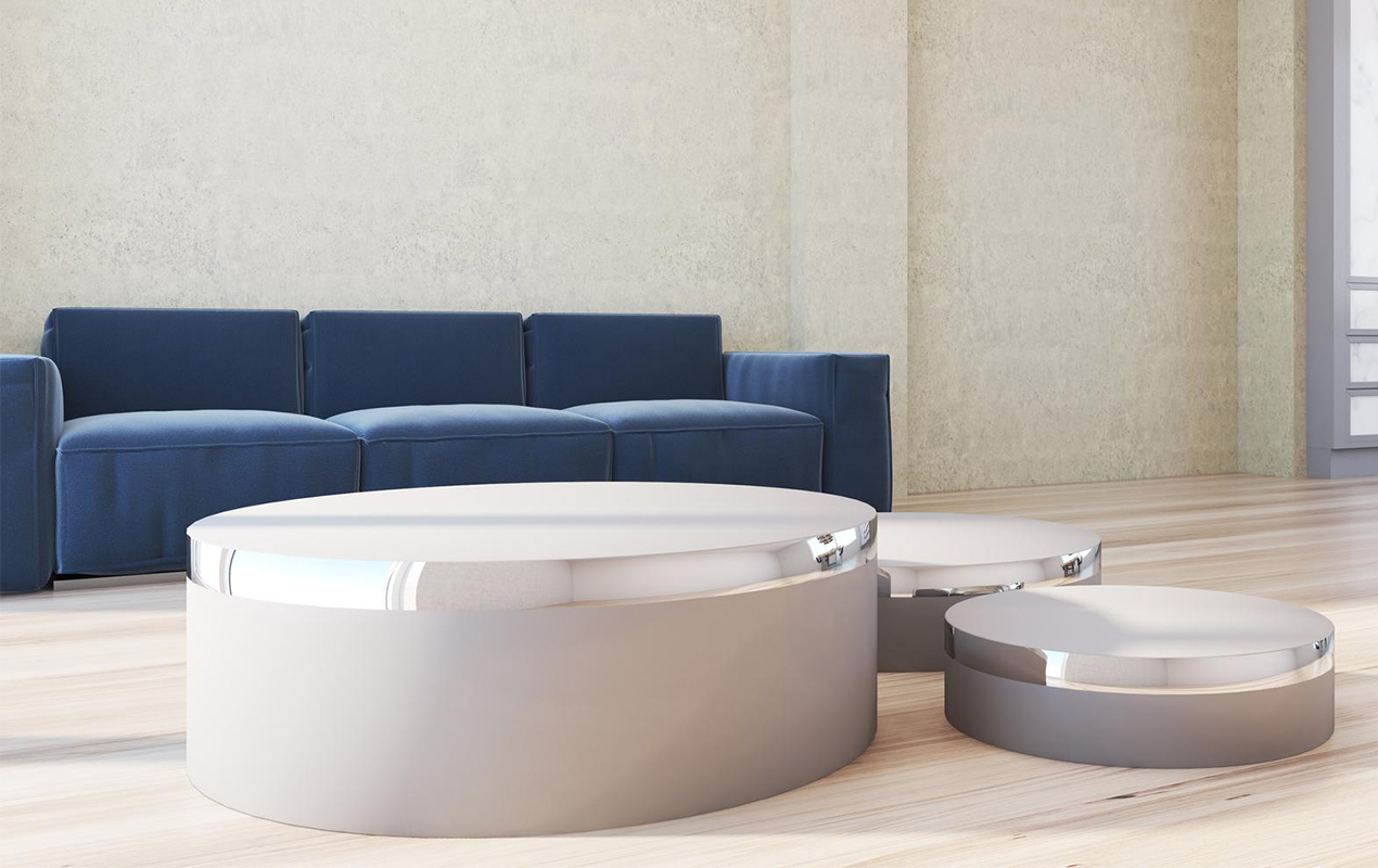 The Round Silver Coffee Table and Luxurious Blue Sofa Ensemble