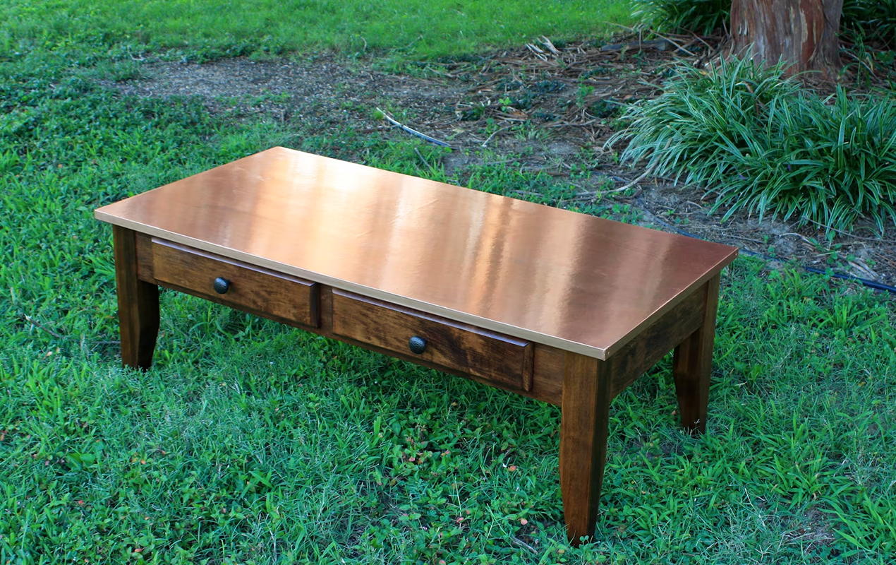 Functional Panache: The Grand Copper Coffee Table with Drawers