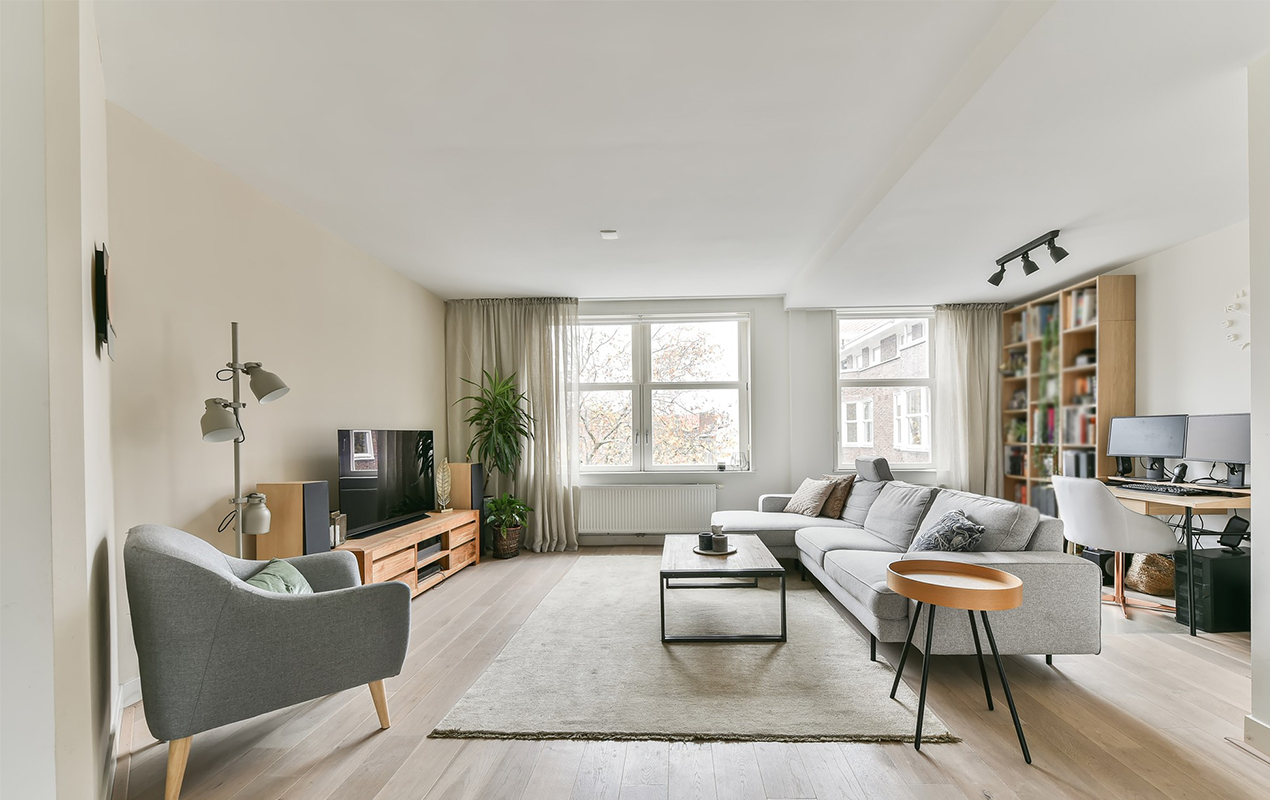 White living room interior with sofa and table