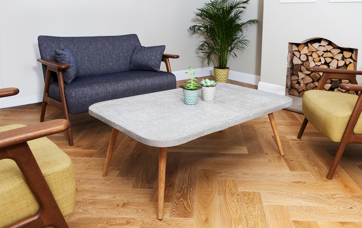 Living room interior with herringbone flooring and mid century table 