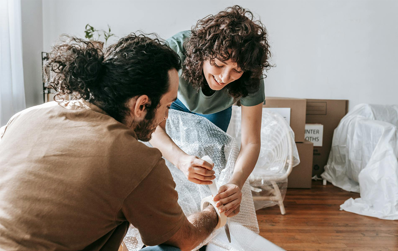 a couple packing a chair