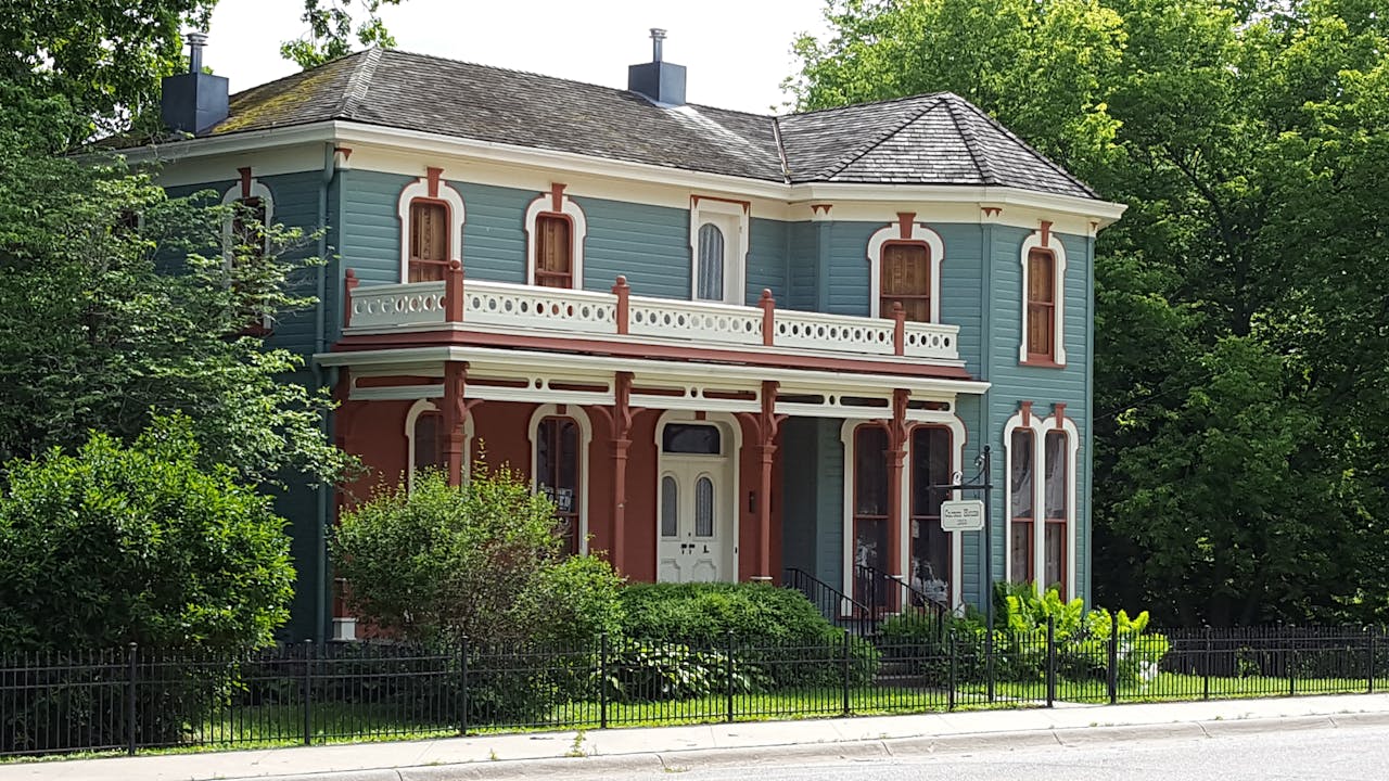 Traditional style home with fencing 